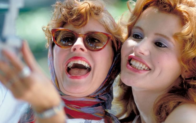 Thelma and Louise (played by Susan Sarandon and Geena Davis) take a primitive selfie. They look great.