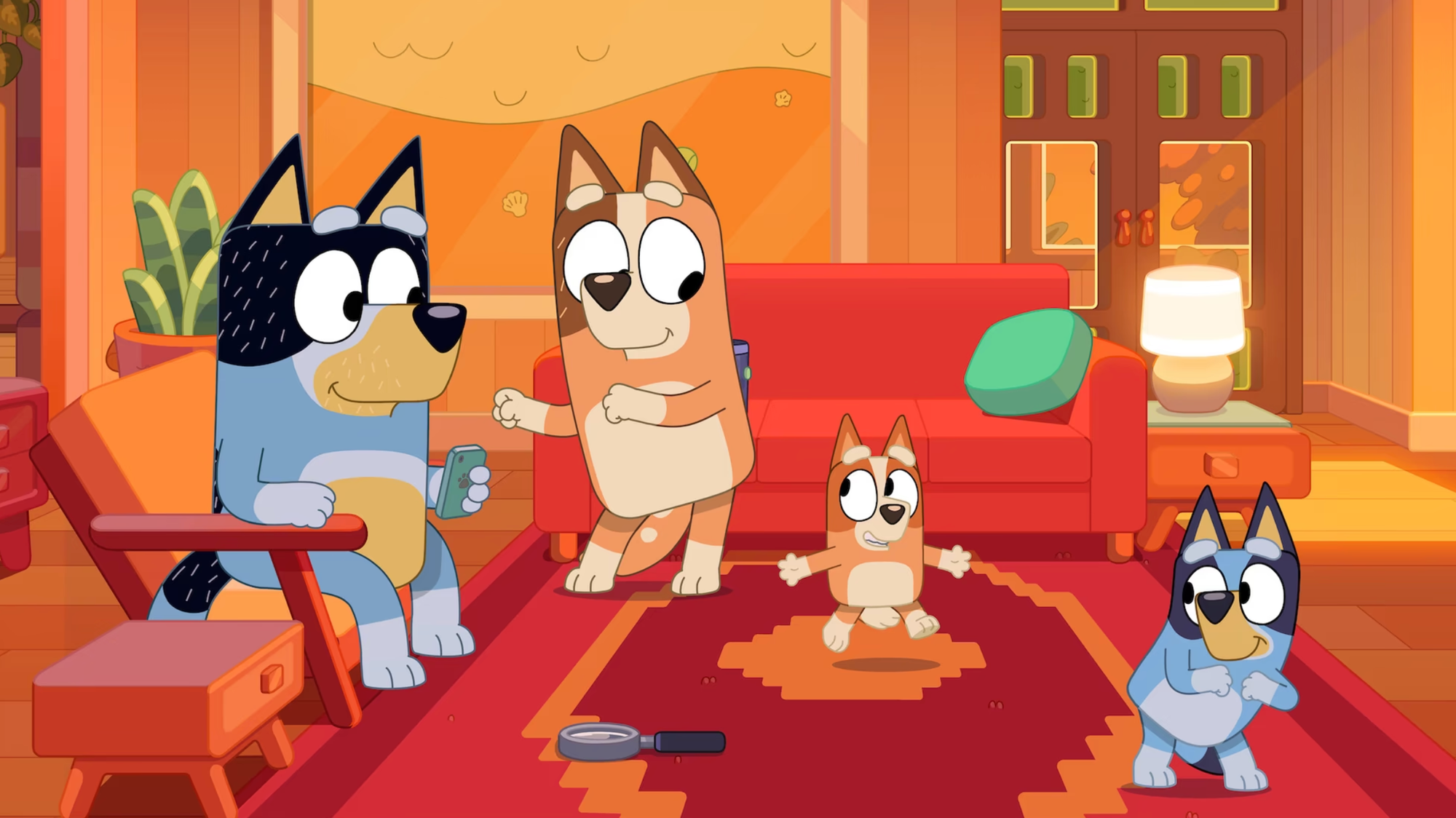 The Heeler family, four anthropomorphic, animated dogs, boogie down in a room dominated by red colors.