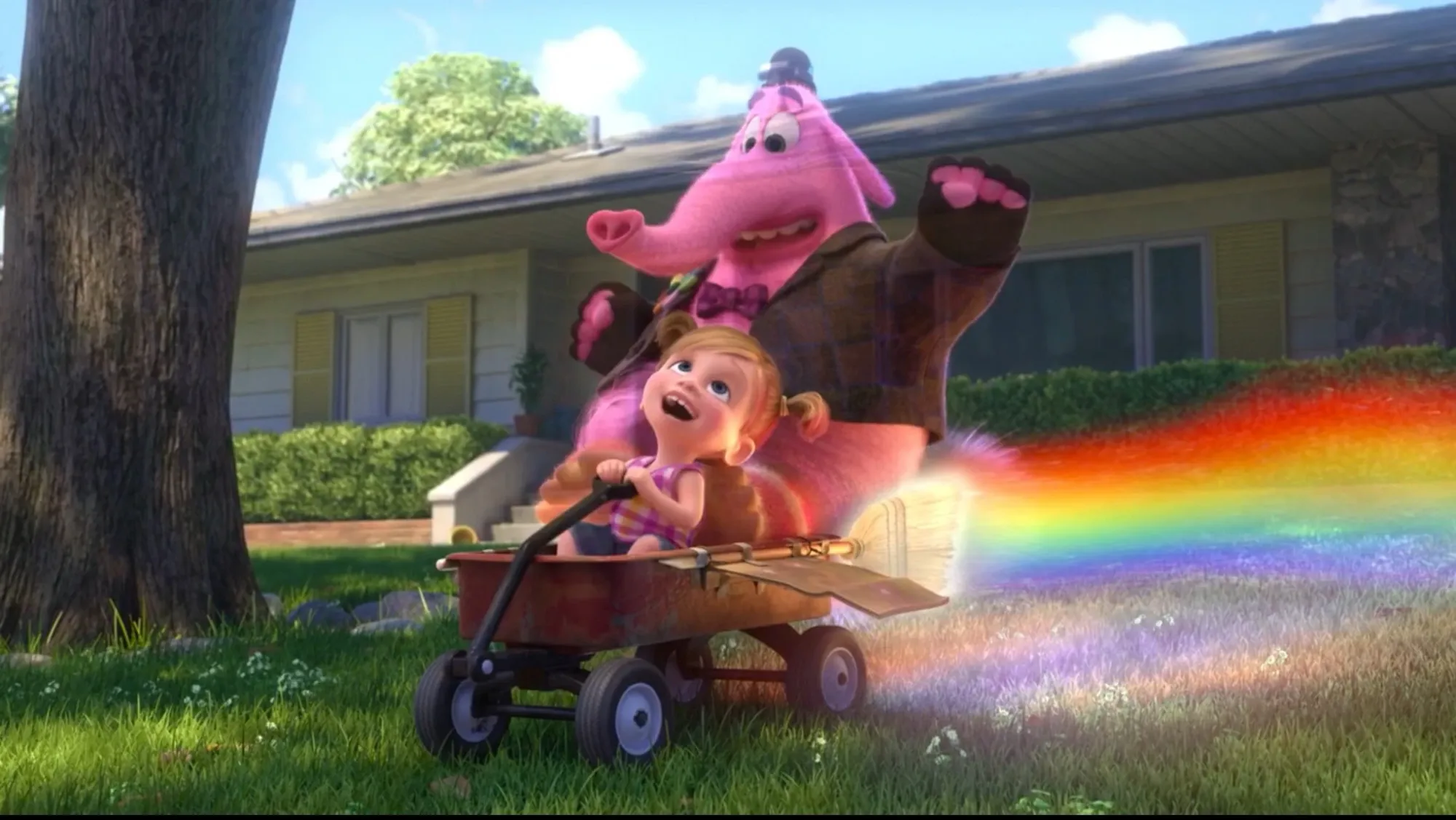 A young Riley rides in a wagon, her imagined Bing Bong behind her. The wagon spouts rainbows.