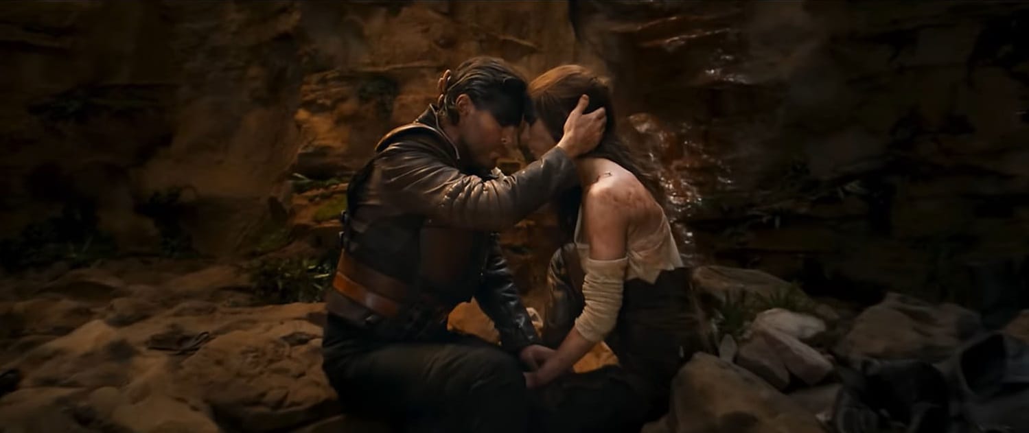 Praetorian Jack and Furiosa press their foreheads together in the midst of the horrors.
