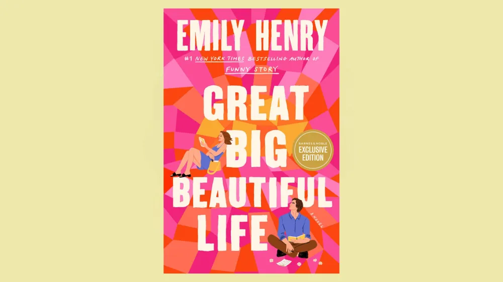 The cover of Emily Henry's Great Big Beautiful Life features a woman reading and a man gazing up at her from where he's writing.