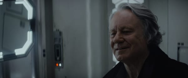 Luthen practices his pleasant antique dealer smile as he prepares to leave his Rebel life behind.