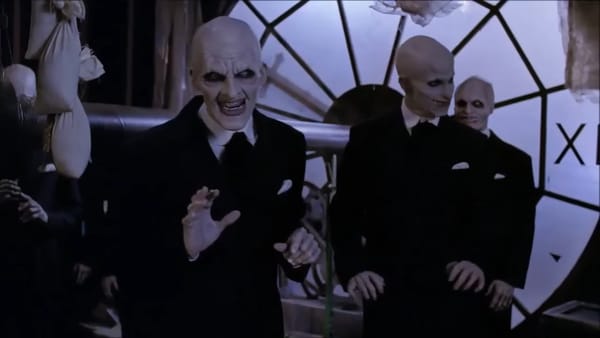 The Gentlemen in Buffy are bald, white-painted guys in suits with sharp teeth. They're inside a clock.