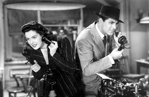Hildy and Walter talk on the phone in the immortal black and white classic His Girl Friday.
