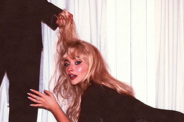 The cover of Sabrina Carpenter's Man's Best Friend features her leaning by a man's crotch as he holds her blonde hair like a leash.