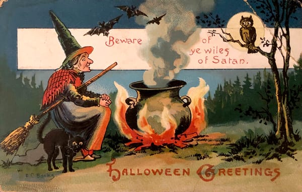 A vintage Halloween postcard sees a witch sitting near a cauldron with a black cat and owl. Text: Beware of ye wiles of Satan. Halloween Greetings.
