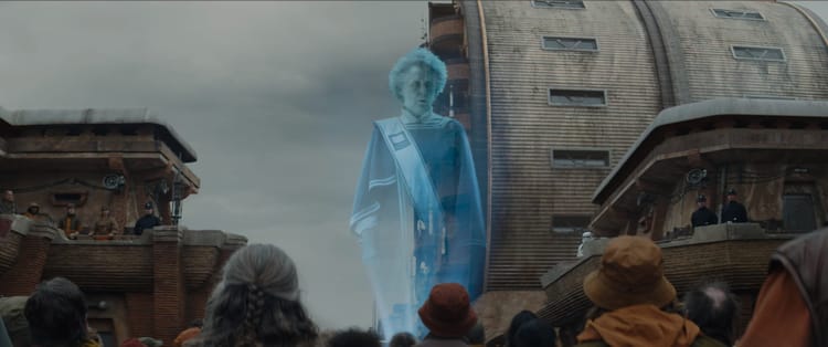 The enormous hologram of Maarva hovers above the citizens of Ferrix, addressing them at her own funeral.