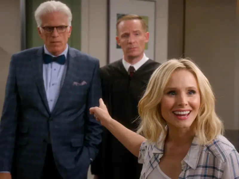 Eleanor's face looks deeply surprised as she points at Michael in the season one finale of The Good Place.