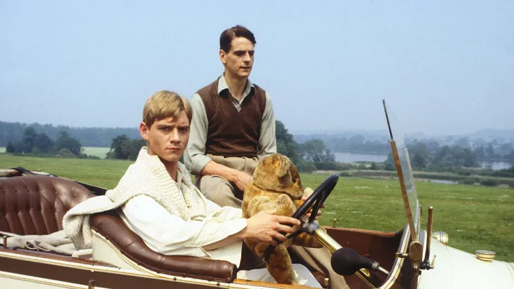 Anthony Andrews (all in white, holding a bear) and Jeremy Irons star in the BBC miniseries version of Brideshead Revisited.