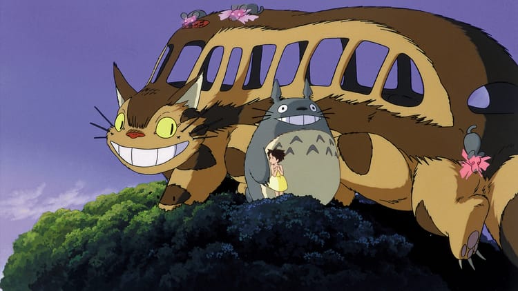 Totoro and his little friend Satsuke hang out in a treetop with the enormous catbus, which is exactly what it sounds like.